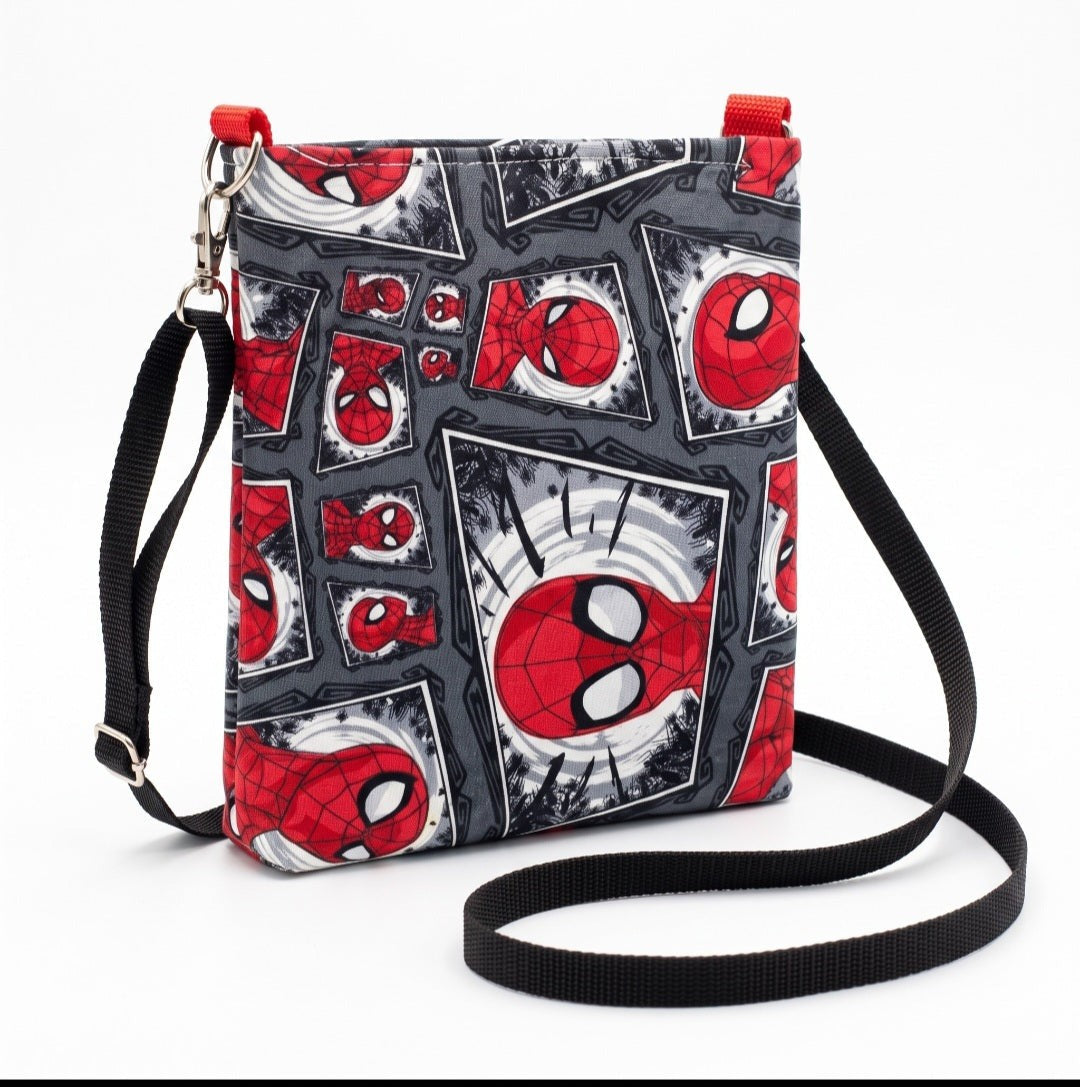 JUST-JEN BOUTIQUE Spider-Man comic print crossbody bag with adjustable black strap and red accents on white background