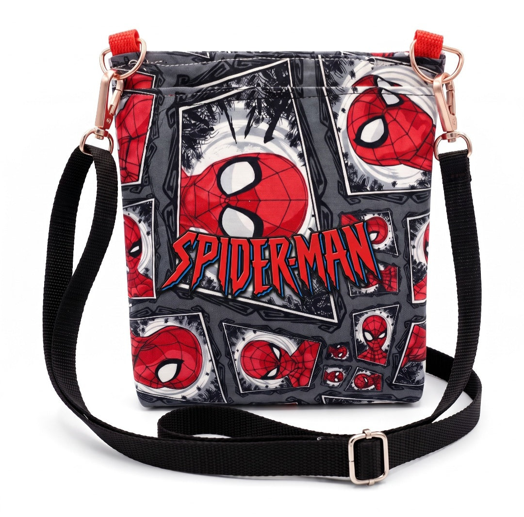 JUST-JEN BOUTIQUE Spider-Man crossbody bag with comic book print, adjustable black strap, and rose gold hardware.